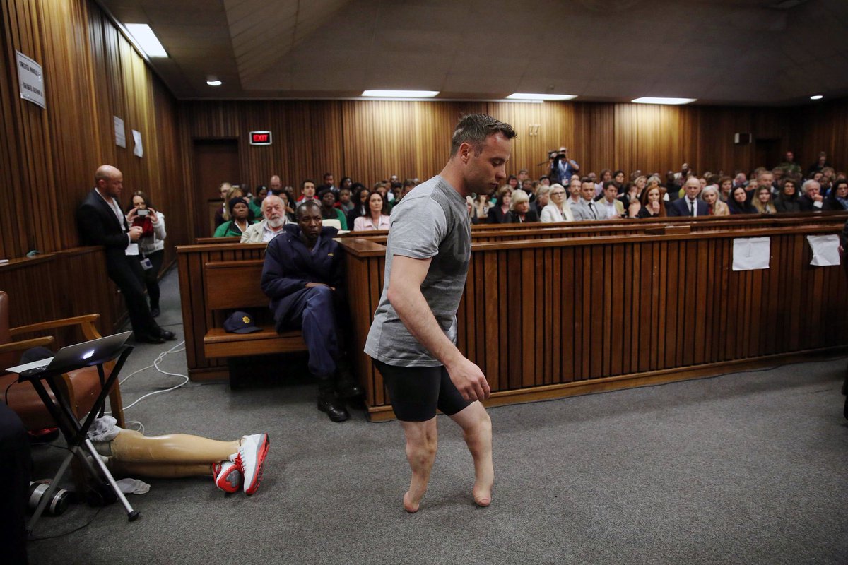 Oscar Pistorius demonstrates walking without his prosthetic legs in court audience, 2016.