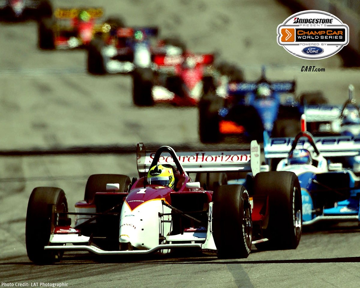 🇧🇷 Bruno Junquiera, in the #1 Pacificare sponsored Newman-Haas Racing car, leads 🇨🇦 Paul Tracy and a train of Champ Cars during the 2003 Molson Indy Vancouver.
