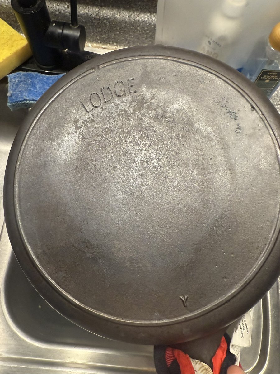 My mom gave me a cast iron pan that was my great grandma’s. It’s about 80-100 years old and was covered in rust and other stuff.  I made an electrolysis tank out of a laptop power supply and some scrap metal I had and it’s looking good after about 5 days of restoration