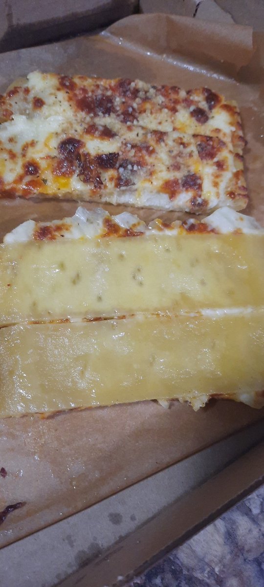 theswedMN's tweet photo. Cheese bread that looks like this is not edible and a safety risk with raw dough. Pizza wasn't much better just done but very pale.   @caseysgenstore https://t.co/wviug60WqR