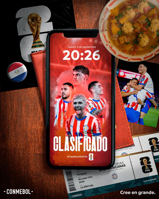 A smartphone displaying a digital image of the Paraguay national soccer team in red and white striped jerseys. The screen shows multiple players smiling and posing together. Surrounding the phone are a bowl of soup, a flag of Paraguay, match tickets, and a trophy resembling the FIFA World Cup. Text on the phone screen reads 