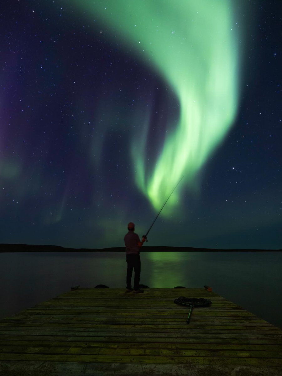 🎣✨ Imagine you cast your line, hook your biggest catch yet, then look up and let the sky put on a show. Where else can a fishing story end with the Aurora dancing overhead? 🌌

In the Northwest Territories, the Northern Lights are visible more than 240 nights a year, with fall