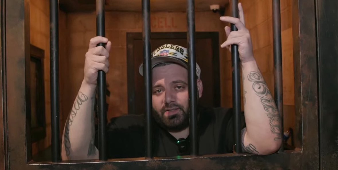 Jalen Carter in the locker room watching his teammates fight without him