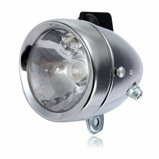 Bicycle dynamo and the front light. Our grandfathers and uncles treasured these things. A black mamba with a dynamo was the nganya of the village.