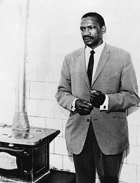 Robert Sobukwe in his house on Robben Island. After his sentence expired, the South African government voted each year to keep him confined near the government's prison.