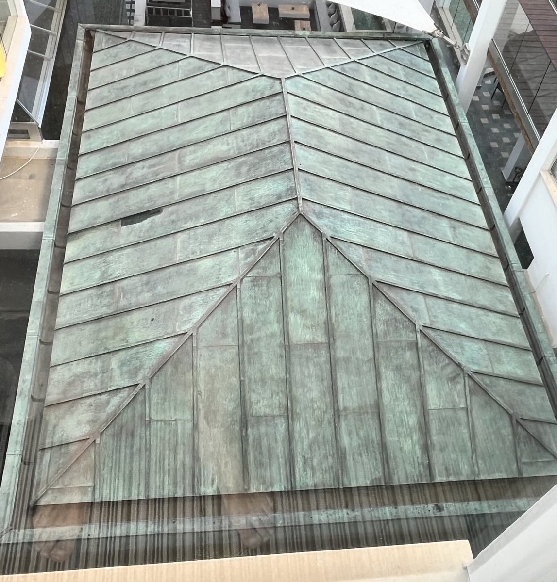 PlannetPlumbing's tweet photo. Sheet copper roof I spotted at a hotel I was staying in. I bet not many Plumbers can do this these days. I’ve not done any since I was an apprentice (1980-84). It will turn a nice even green colour in time. Great craftsmanship. https://t.co/c9xqgJBQmn