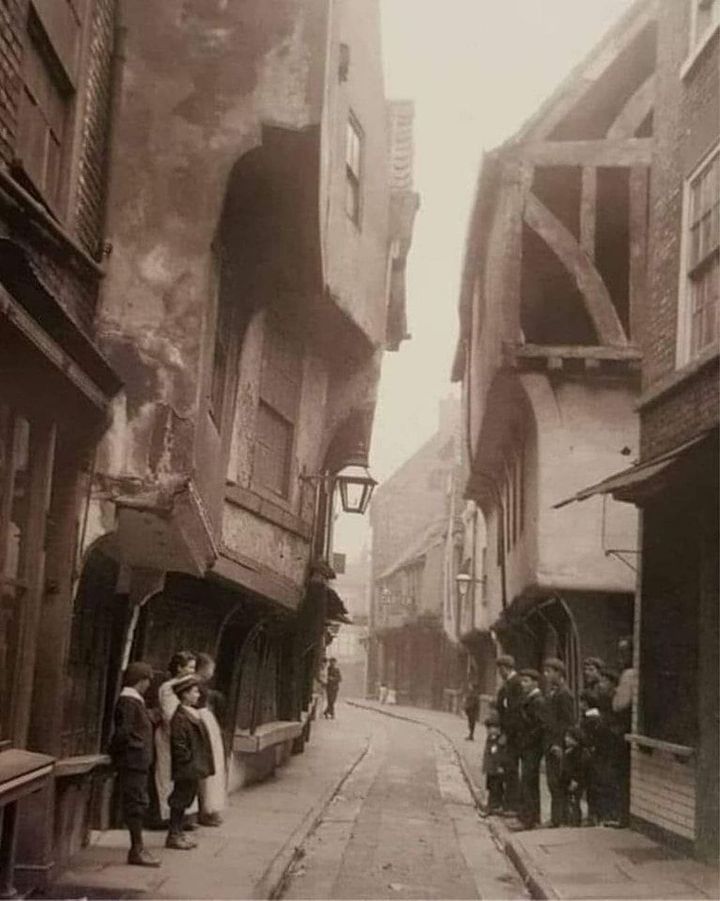 The Shambles in York, pictured in 1900, is still one of the best-preserved medieval shopping streets in Europe. It's a narrow street of mostly timber buildings that date back as far as the 13th Century.