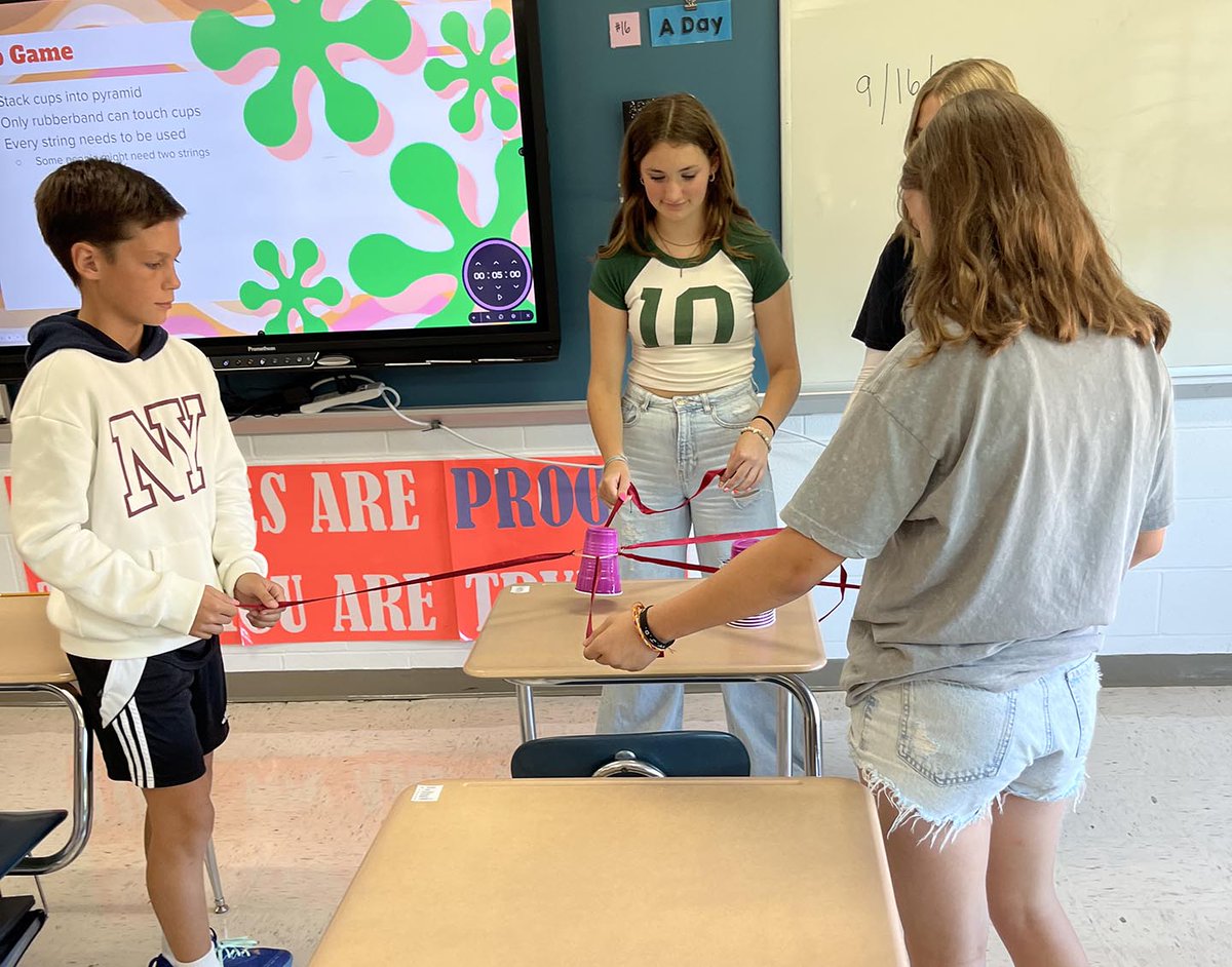 On Wednesday, Mrs. Bell challenged her 8th grade "Adulting" students to work together to stack cups without actually touching them. It was a great exercise in communication and teamwork! #PrideInTheHive