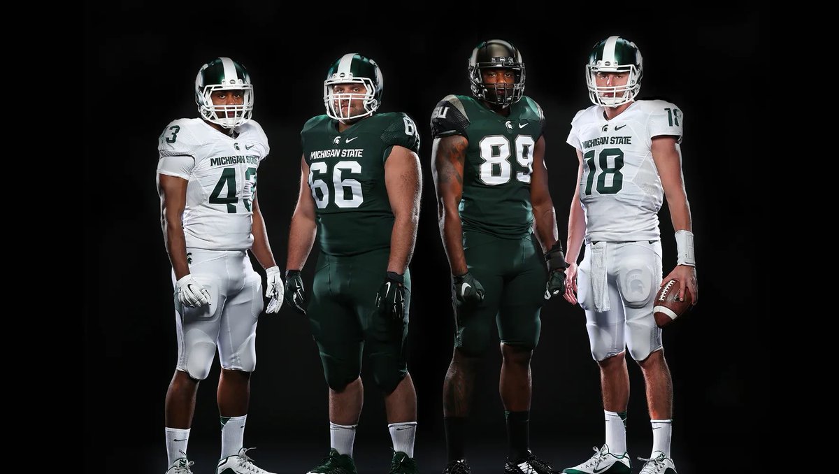 itshohauser's tweet photo. @C_Robinson247 I can always get down with gruff sparty on the helmet, but give me a standard spartan green jersey with a normal font (rather than the block font on the alternates) and I’m good. Think this era + gruff sparty would be peak MSU jersey https://t.co/yZQfKEZsNa