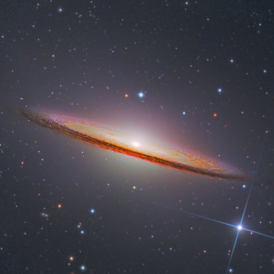 The Sombrero Galaxy. 

29 million light-years away from us.