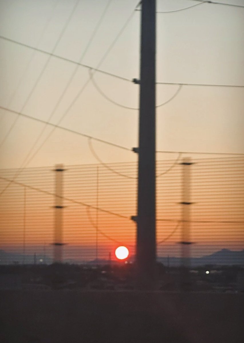 The haze in the air over Salt Lake City turned the sun into a dim, red ball as it set. It was so beautiful and strange!