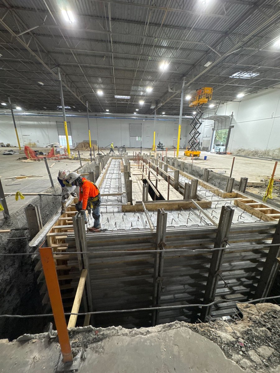 Mine is bigger.  
Lots of activity in Dallas as the we move right  on the Gantt chart. 
Switchgear arrives (think MWh  of power) 
Crane for building modifications 
And last but not least, team has partially filled our big hole, time to strip forms 
Big goals require big tools.