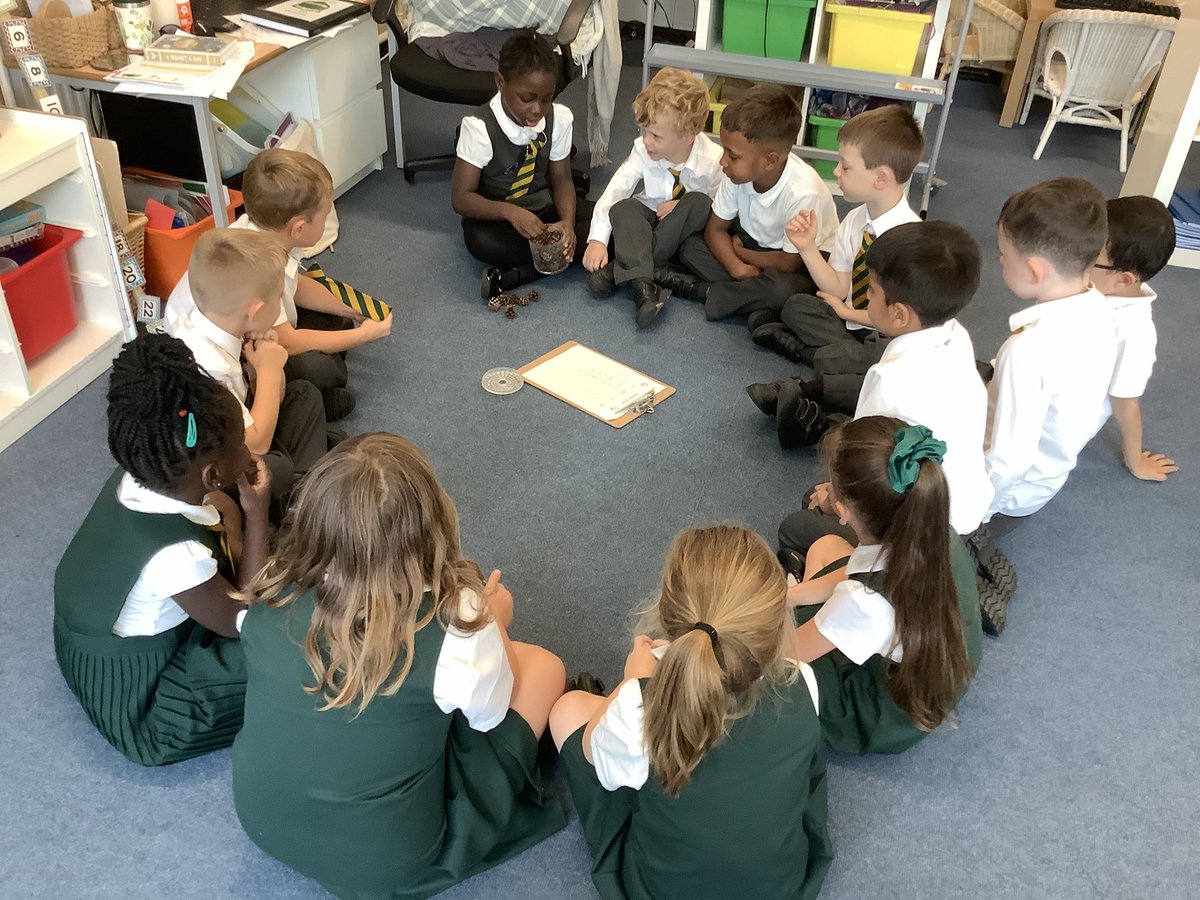 @DosbarthDaioni Counting out the pine cones from the jar to see who won the Estimation Station this week.