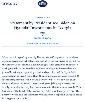 Multiple individuals in tactical gear with "ICE" markings on their vests and jackets, standing outdoors near shipping containers. Some individuals have their hands restrained behind their backs. A watermark from WH.GOV is visible, along with text stating "Statement by President Joe Biden on Hyundai Investments in Georgia" and additional text about economic agendas and job creation.