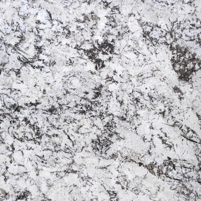 Discover the timeless elegance of White Orion, a stunning granite sourced from Brazil's majestic mountains. Its pristine white base accented with speckles of grey, black, and shimmering crystals makes every space feel luxurious.
