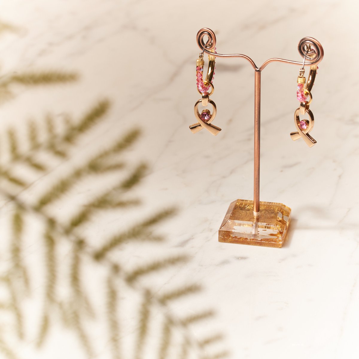 Crystal Passions® rose shimmer beads complement Breast Cancer Awareness ribbons in these earrings, combining elegance with a steadfast commitment to support.
You can find more details about this design inspiration here: firemtn.co/4gdylrh