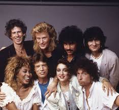crockpics's tweet photo. Keith Richards, Daryl Hall, John Oates, Ron Wood, Tina Turner, Mick Jagger, Madonna and Bob Dylan are photographed backstage at Live Aid on July 13, 1985 at JFK Stadium in Philadelphia, Pennsylvania https://t.co/tiEf8ZmpYh