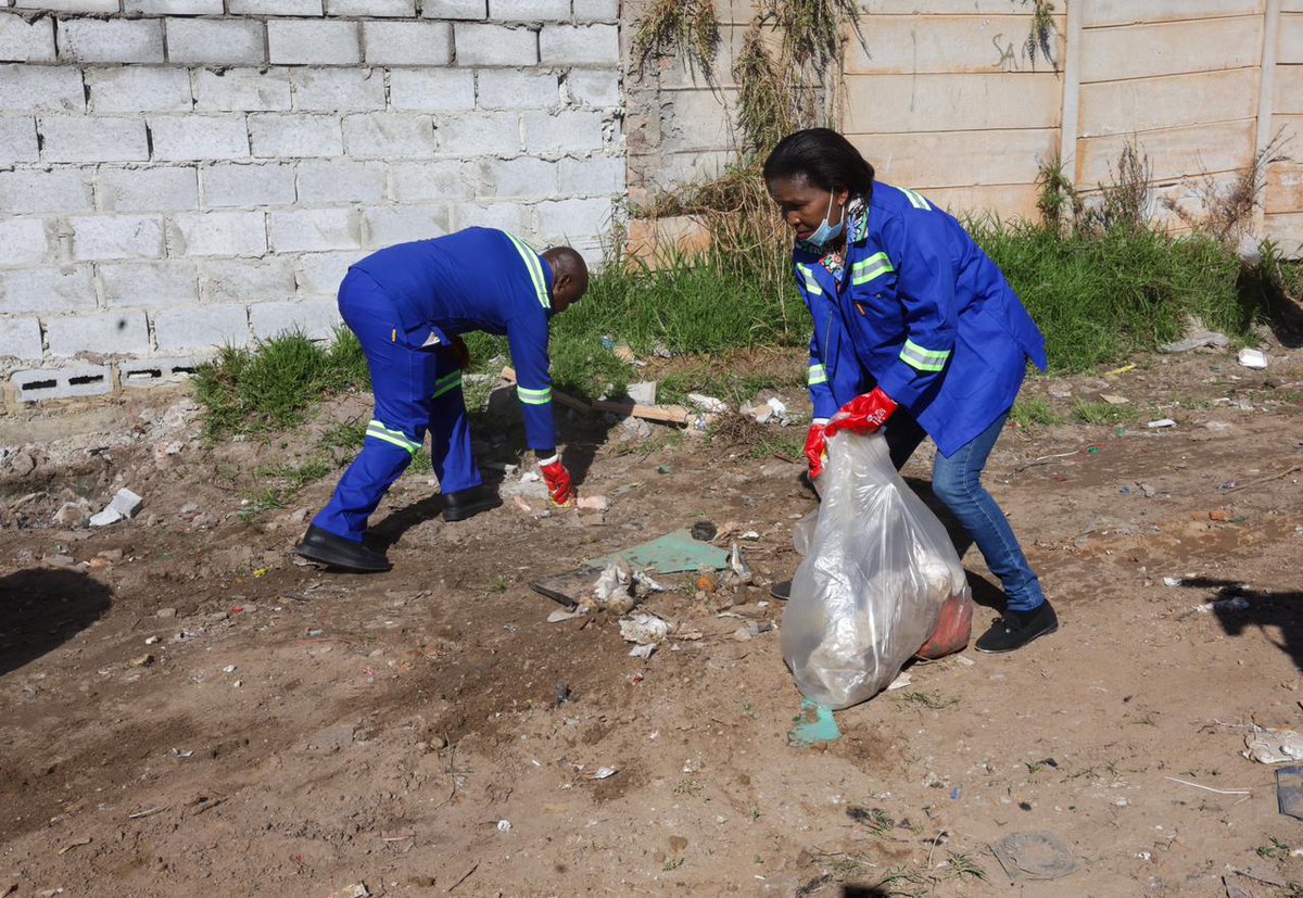 GovernmentZA's tweet photo. [Photos] As part of the Clean Cities, Towns and Villages Campaign in the Overstrand Local Municipality, the Minister of Tourism, Ms Patricia de Lille leads the cleaning of ward 5 and 12 in Zwelihle Township, as part of fostering cleaner healthier and more sustainable urban and rural environment.

The Minister also planted trees in Zwelihle Sports Ground, to ensure cleaner air and improving the quality of life. 

The Minister is joined by the President of South African Local Government Association (SALGA), Bheki Stofile, the Mayor of the Overstrand Local Municipality, Cllr Archie Klaas, as well as senior government officials.  #GovZAUpdates #CleanCitiesWC