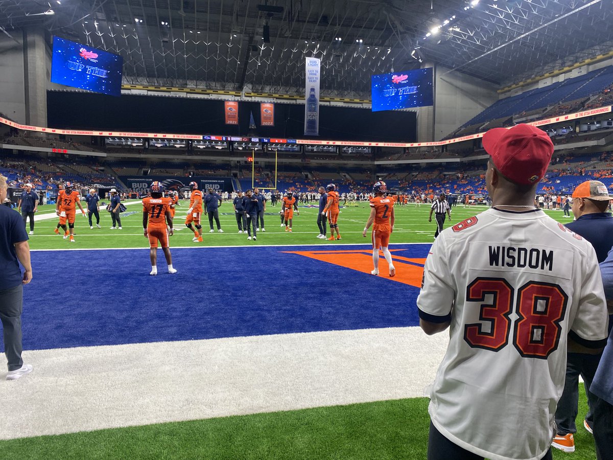 Frank Harris, rocking his Rashad Wisdom jersey, keeping an eye on his successor, Owen McCown.