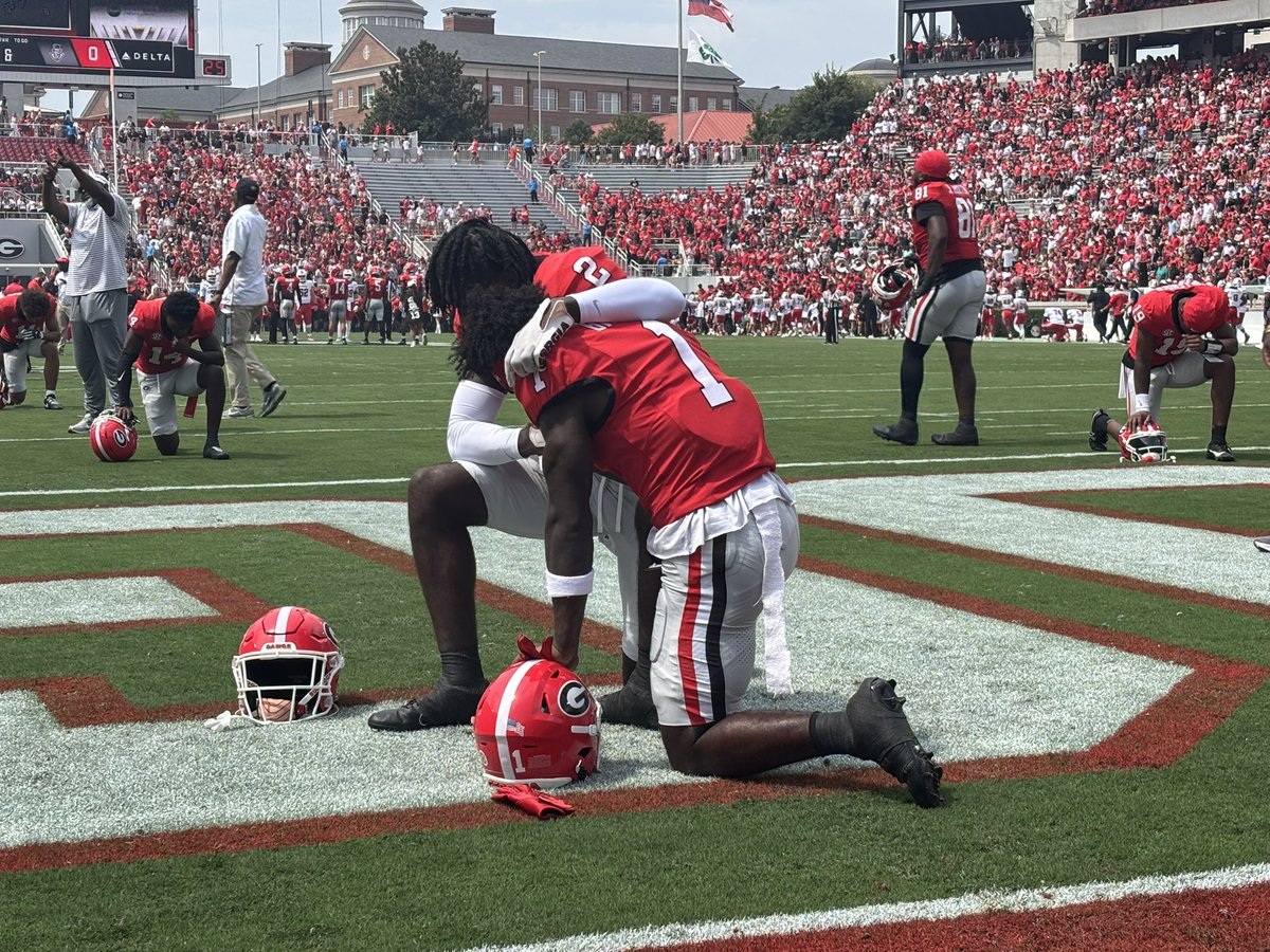 LM_Sports_Media's tweet photo. The Branch brothers praying together. 

Wholesome moment. https://t.co/bh3CxksuKi