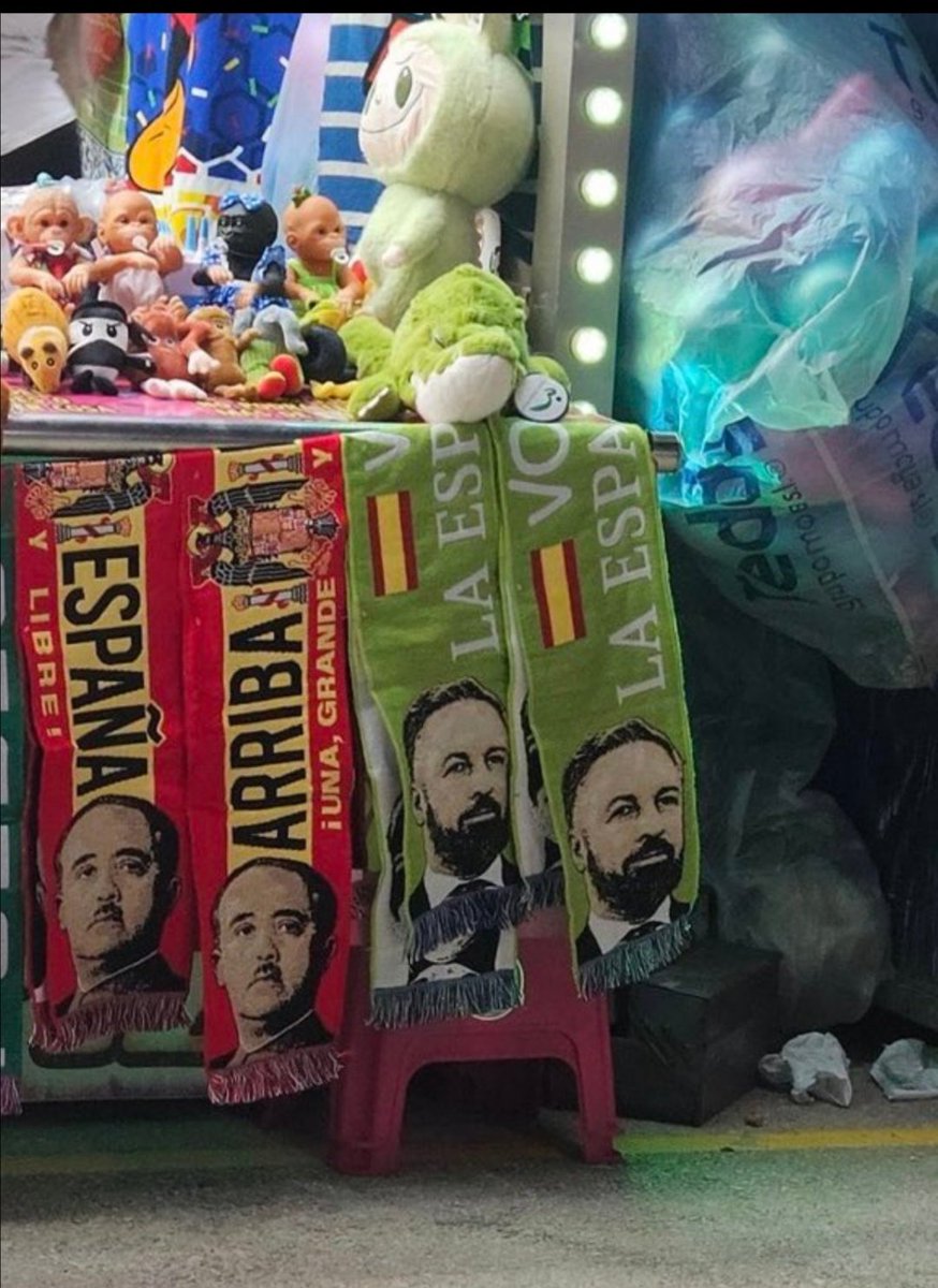 FonsiLoaiza's tweet photo. En pleno 2025 se exhiben en la Feria de Murcia bufandas del genocida dictador de Franco. https://t.co/9On5r6IzQM