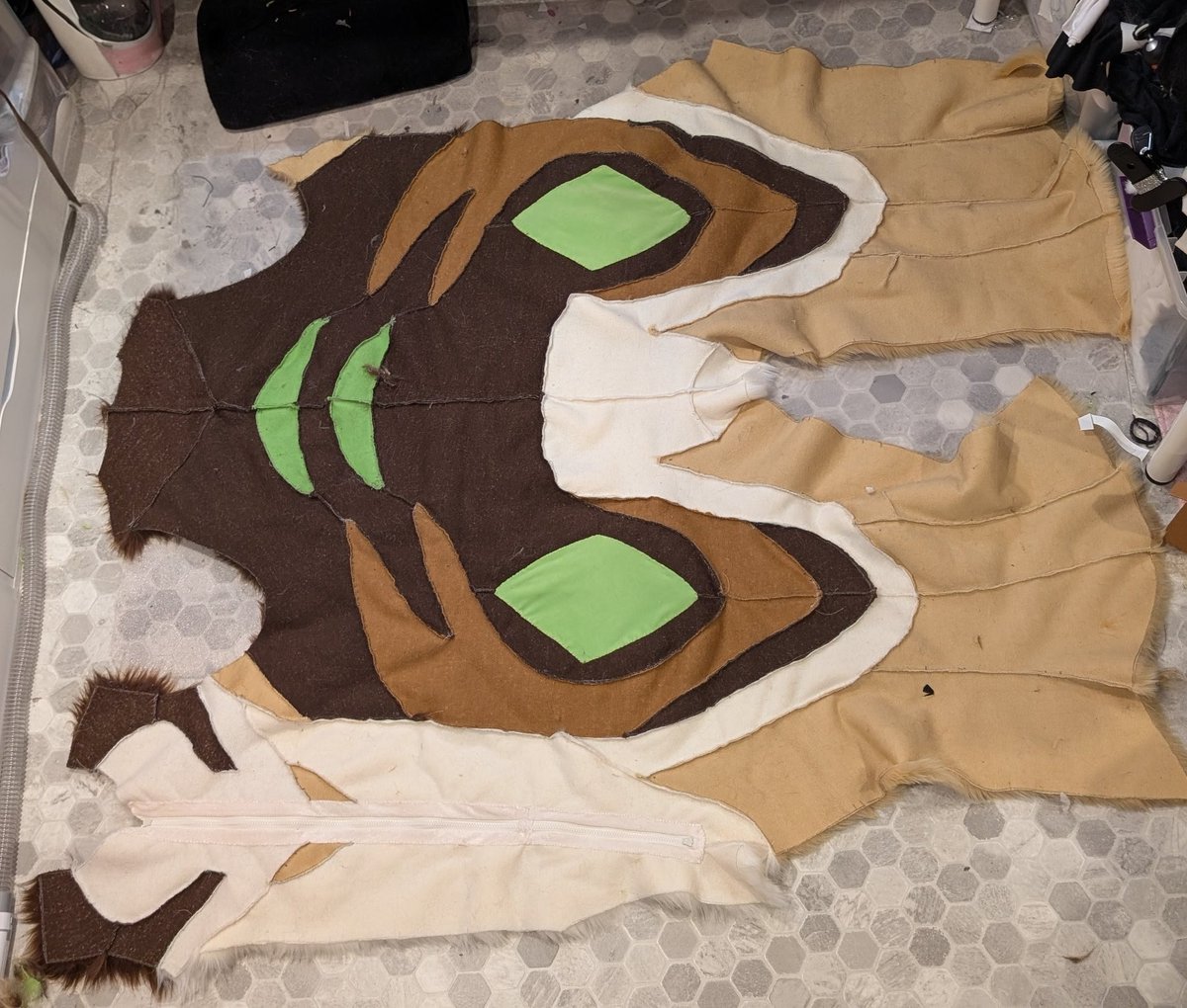 It's a UV map of a fursuit! Kinda... It's missing the arms, those wouldn't fit in the photo 😂 

Finishing the final seams on this guy, nabbed a pic before he becomes a fully sewn body suit!