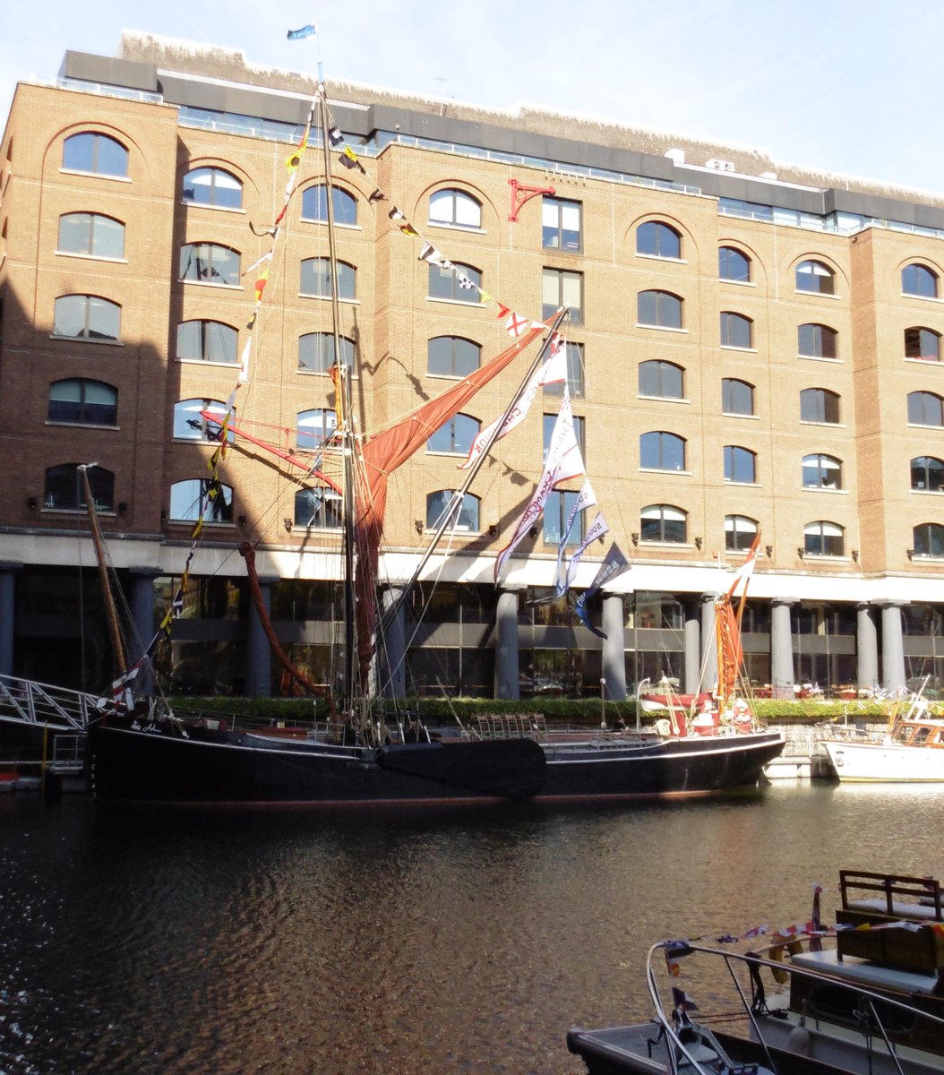 Barges Gladys and Adieu flying the flags at the Classic Boat Festival <a href="/StKatsMarina/">St Katharine Docks Marina</a>