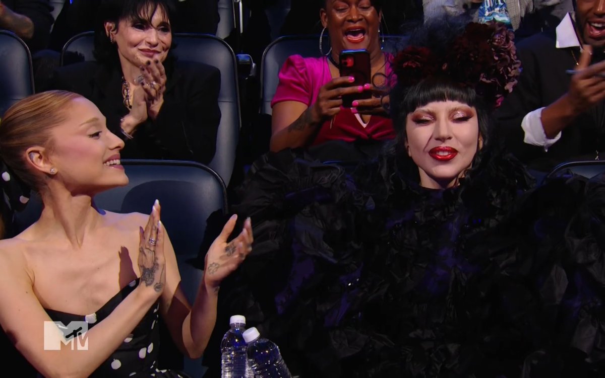 Lady Gaga is sitting next to Ariana Grande at the #VMAs