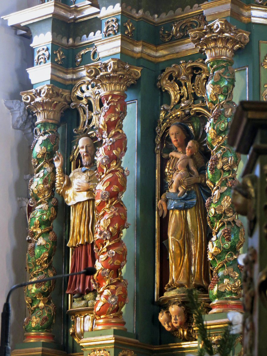 ART SACRÉ A L'ÉPOQUE BAROQUE : COLONNES TORSADÉES ET ENLACÉES DE VIGNE
Retable (détail), c. 1785. Eglise Notre-Dame de l'Assomption, Cordon, Faucigny (Haute-Savoie)
Les colonnes torses sont caractéristiques des retables baroques. Elles sont souvent habillées de grappes de raisin.