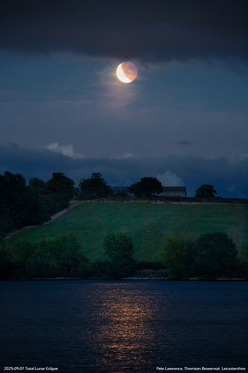 Receding partial phase of last night's total lunar eclipse. Always going to be a tricky one from the UK, especially with lots of cloud around. But there were gaps. This is from Thornton Reservoir in Leicestershire.