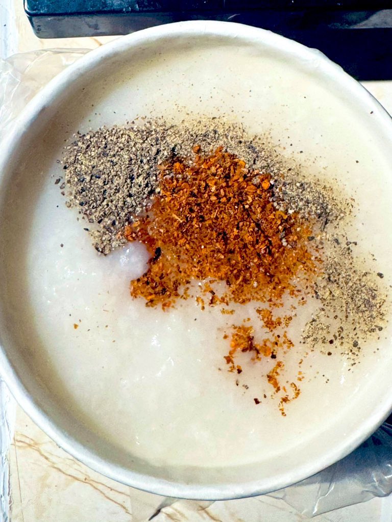 nejsnave's tweet photo. ⭐️⭐️⭐️ CHEAPEST MEAL TIP: #Congee is basically rice porridge and one of the cheapest meals you can make that is also so delicious and satisfying; it can stretch a cup of rice into as many as seven litres of hot yummy satisfying food.
one cup of rice (any rice, even broken rice or frozen rice) to up to seven cups of liquid; ideally half stock, broth or bullion but if you only have a little stock or one cube you can make it with mainly water and add anything else you have to generate flavour; leftover vegetable bits, the bitter end of a chicken, any greens at all, soy sauce, I've even seen mayo used which is after all just oil and egg.
Mushrooms are great, carrot tops, literally any part of any vegetable will get cooked into the rice and its flavour pulled out. Sesame seeds, sunflower seeds, Maggi seasoning. Marmite is great even if you don't like it because it mellows the flavour into something beefy and comforting.
Some congee here is topped with fried bread and greens; toss whatever greens or other leftovers you have in the freezer throughout the week and add it.
You need a big pot and some time. Stir stir stir and add whatever you've got until it's a porridge consistency. Keep it on the stove for as long as possible. A couple of raw eggs just before serving cooked to however you like them (put them in right at the end though). Lots of pepper and spice if you can tolerate it.
It can fill little bellies with warmth and be *so* delicious and satisfying even just with onions. You literally need a cup of rice and a couple of bullion cubes and you've got seven litres of food. You can freeze it and reheat it, just be a bit careful with the timing and don't let the rice get too old.
This may become one of your new go-tos as winter approaches. You can also make it sweet! But that's another post ...
❤️🔥❤️🔥❤️🔥
📸 chicken congee with black pepper and chilis.