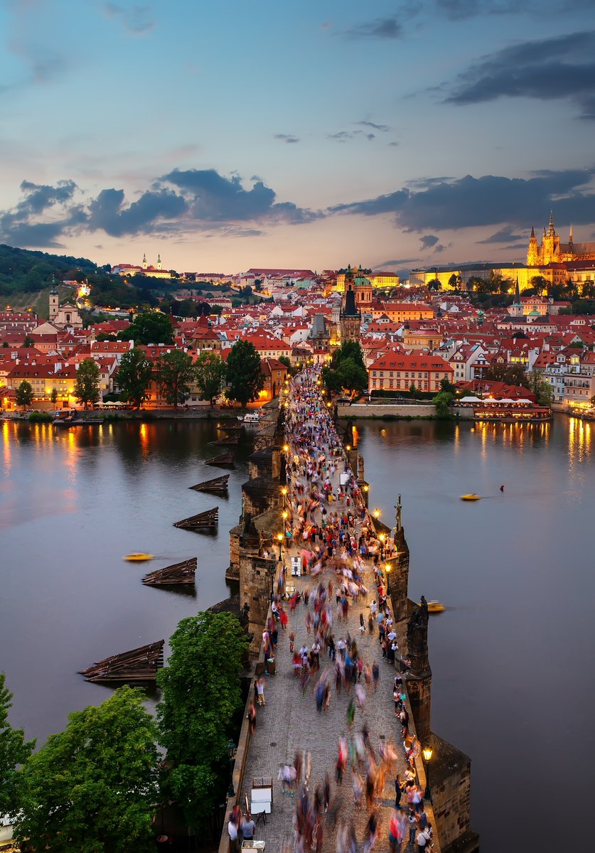 A mesmerizing sunset view of Charles Bridge in Prague, Czech Republic.