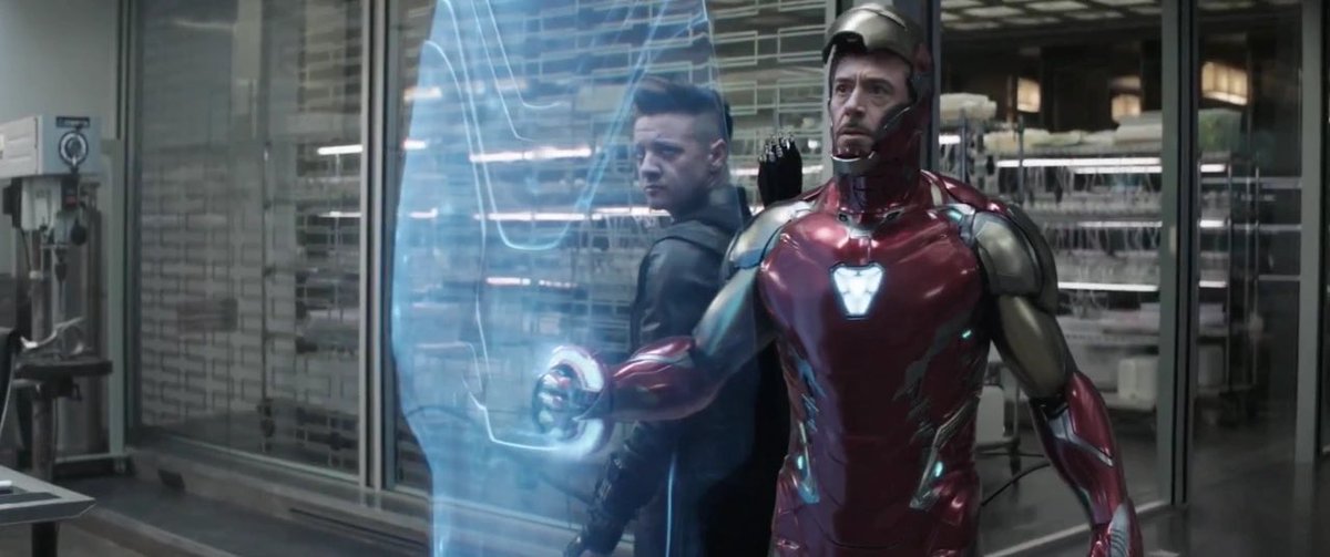 Illustration of Iron Man and Hawkeye with holographic tech, symbolizing advanced blockchain security protocols