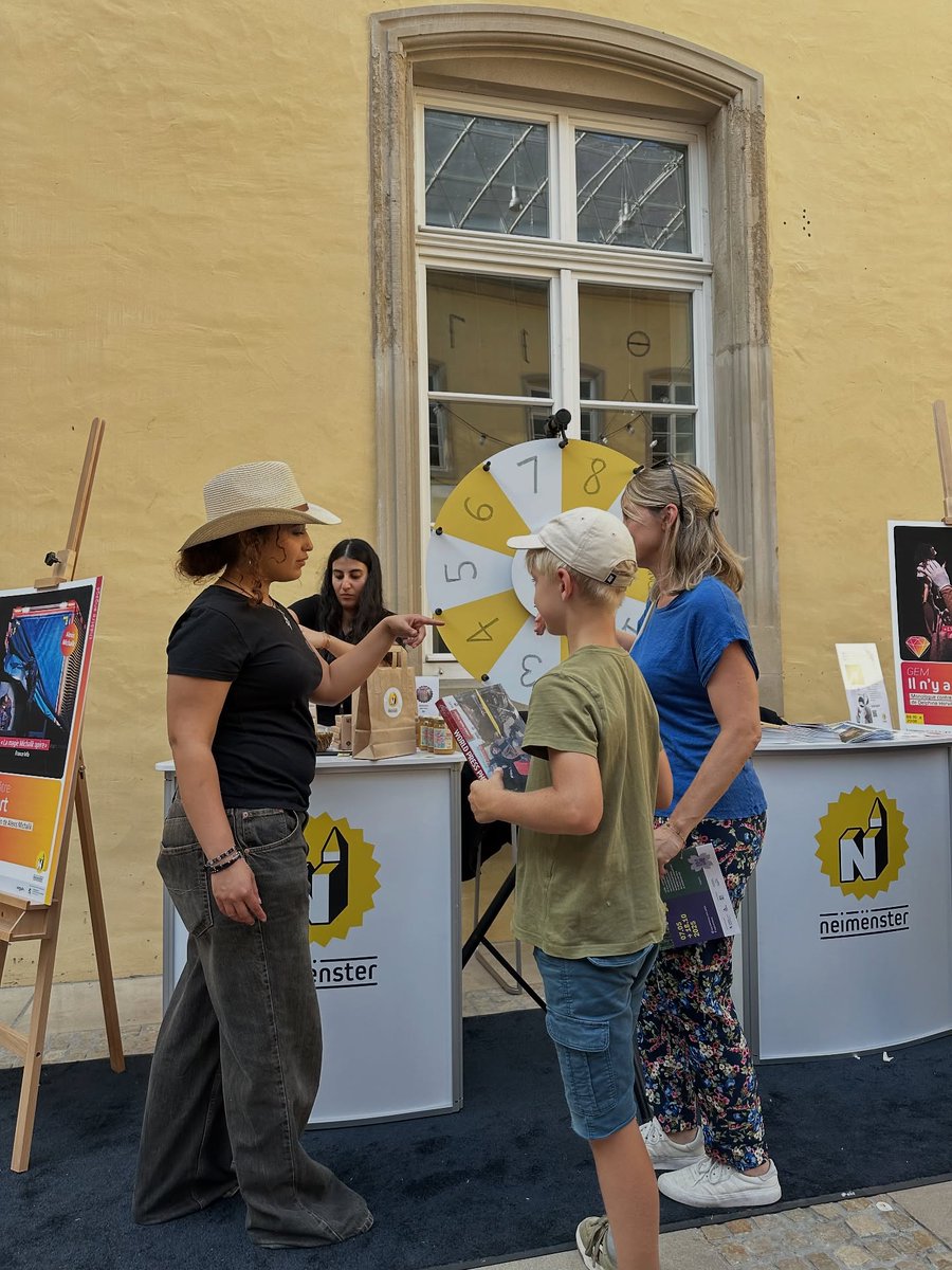 neimenster's tweet photo. #LuxembourgExpatDay 2025 : what a success ! A huge thank you to the on-site neimënster team for animating our stand. Visitors got to explore neimënster and our cultural program, and had fun with the fortune wheel 🎡 and thank you to Brain &amp; more for making it all happen ! https://t.co/Unl4ybR4mM