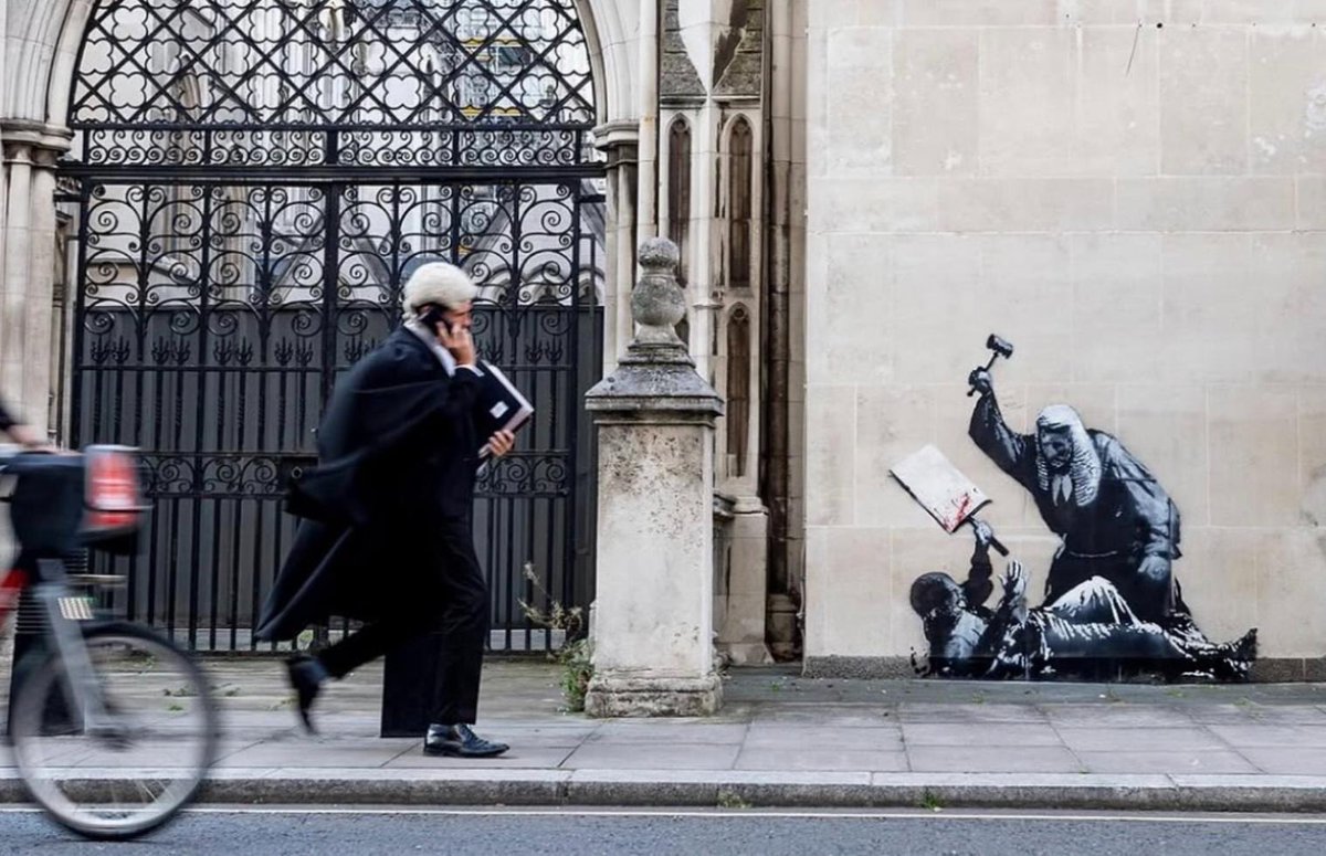 We DID get a Banksy!

It depicts a judge swinging to hit a protestor with a blank sign with his gavel, symbolising the state brutality unleashed on protestors following the proscription of Palestine Action.

Sign up for action in October: wedonotcomply.org