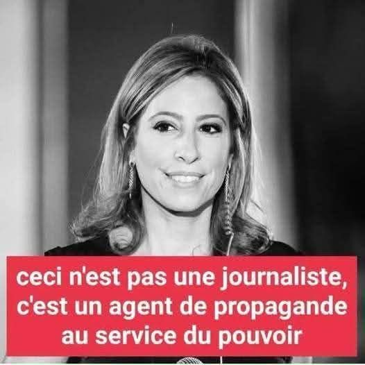 A black-and-white photo of a woman with shoulder-length wavy hair, wearing earrings, smiling, and dressed in formal attire. Red text overlay reads "Ceci n’est pas une journaliste, c’est un agent de propagande au service du pouvoir."