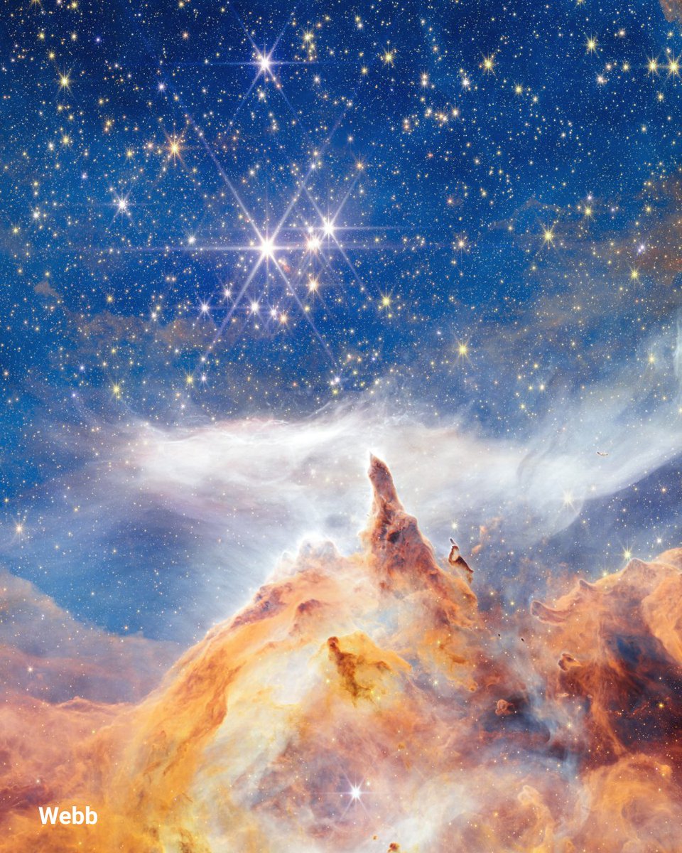 Cosmic crags and clouds ☁️

Pismis 24 is a glittering star cluster, carving the dusty region seen below, as the stars emit intense ultraviolet radiation and stellar winds.