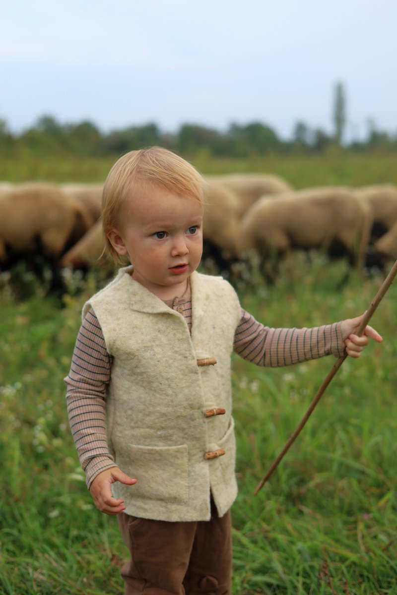 "Self-sufficient, huh? Do you make your own clothes?"

Working on it — this little shepherd is wearing a cozy felted vest his mom made with the wool of his sheep.

<a href="/QueenMokoshI/">Queen of the Marsh</a> is getting fast at producing large pieces of felt, so we will begin gradually replacing parts of our