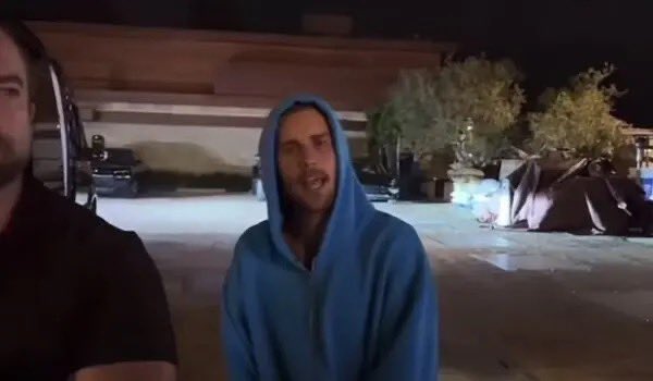 Reaction meme featuring two men, one in a blue hoodie expressing surprise