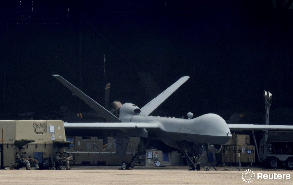 idreesali114's tweet image. A U.S. MQ-9 Reaper unmanned aerial vehicle (UAV) stands parked in front of a hangar in Aguadilla, Puerto Rico September 8, 2025. REUTERS/Ricardo Arduengo