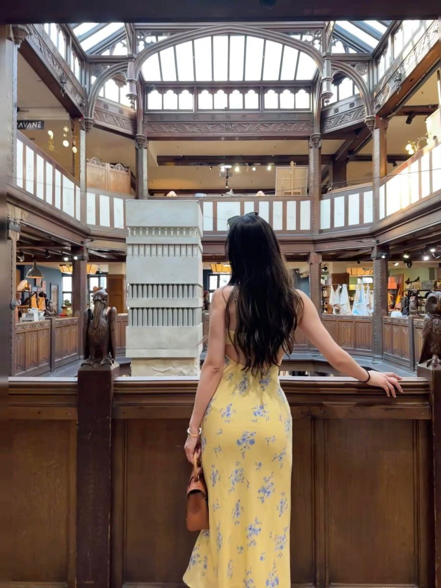 Taking in the breathtaking architecture and the vibrant yellow floral dress.  A perfect day for exploring hidden gems. 🌸