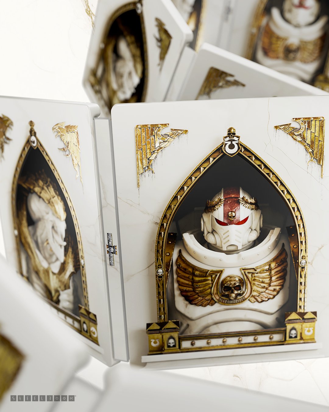A shot of a Space Marine 2–themed SteelBook case. The design shows a white and gold armored Titus framed in a gothic arch with golden wings and skull motifs. The other side of the Steel Book shows a Tyranid in the same colors and decor as Titus. Multiple cases are stacked in a reflective arrangement.