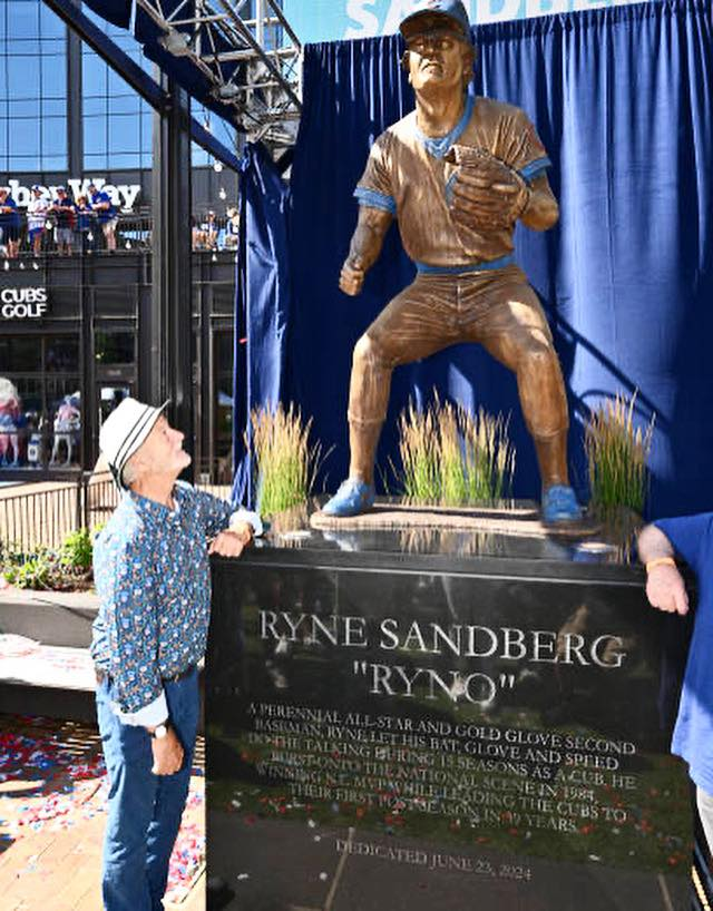 Bill Murray looking at the Ryne Sandberg statue outside Wrigley Field.