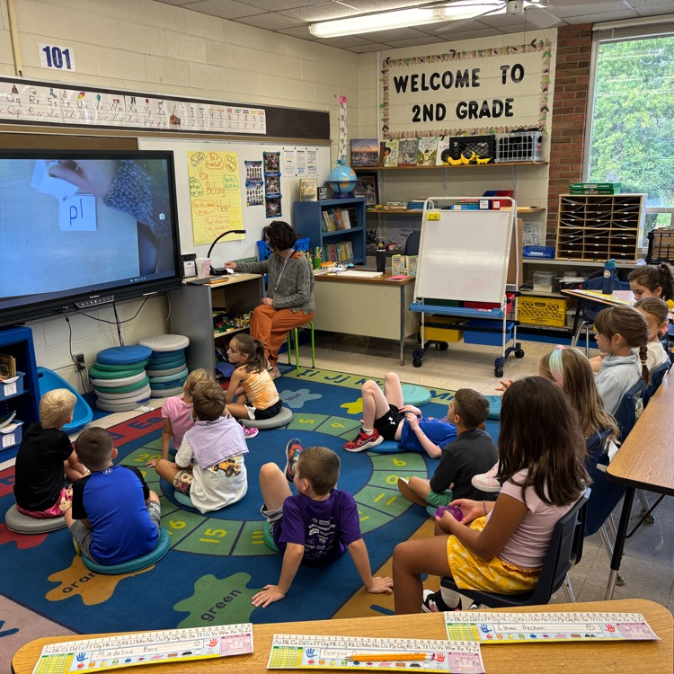 Scenes of fifth grade mathematicians and second grade readers!