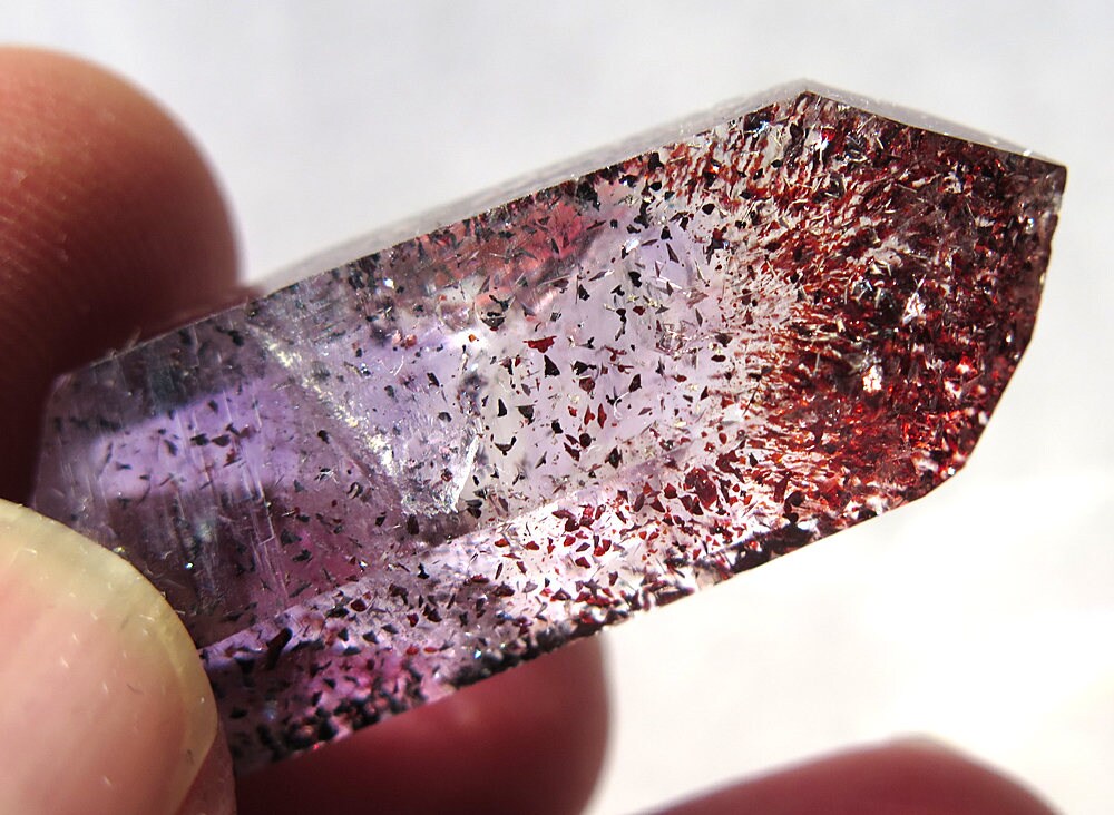 Quartz Inclusions: Hematite’s Hidden Rose 💎

- Gemstones are often admired for their surface sparkle, but the real magic sometimes lies within. 

- Quartz, one of the most common gemstones in the world, has the unique ability to capture and preserve tiny minerals inside it,