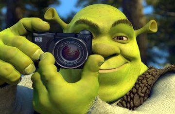 PeriBloxV2's tweet image. I love how this picture of Shrek holding a camera just magically spawned into existence and nobody can find where it originally came from