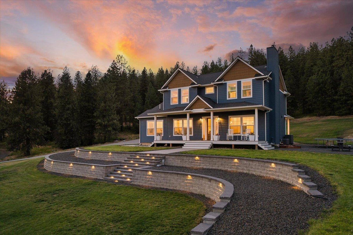 Discover this stunning modern farmhouse in Chattaroy! 🏡 With 5 beds, 4 baths, and nearly 10 acres, enjoy million-dollar views, a chef's kitchen, and a 40x60 shop. Perfect for country living in the Mead School District. 🌟fowlergroup.com/d8rdt41h
