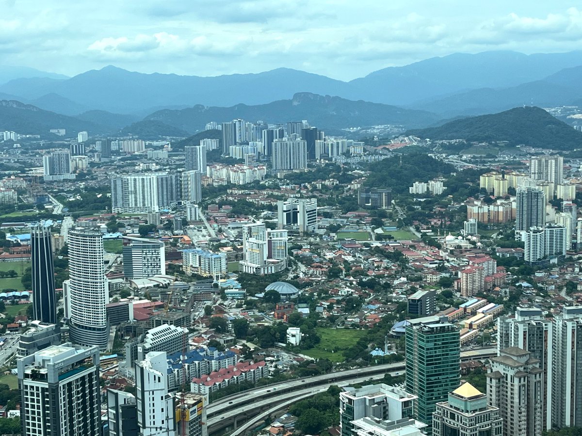 Wrapping up another memorable visit to Kuala  Lumpur, capital of Malaysia. Malaysia’s Ministry of Defence in centre of image, next to the green fields. Titiwangsa mountains in d distance inspired d fictional C2 complex in my book, modelled after Mount Weather, Raven Rock.