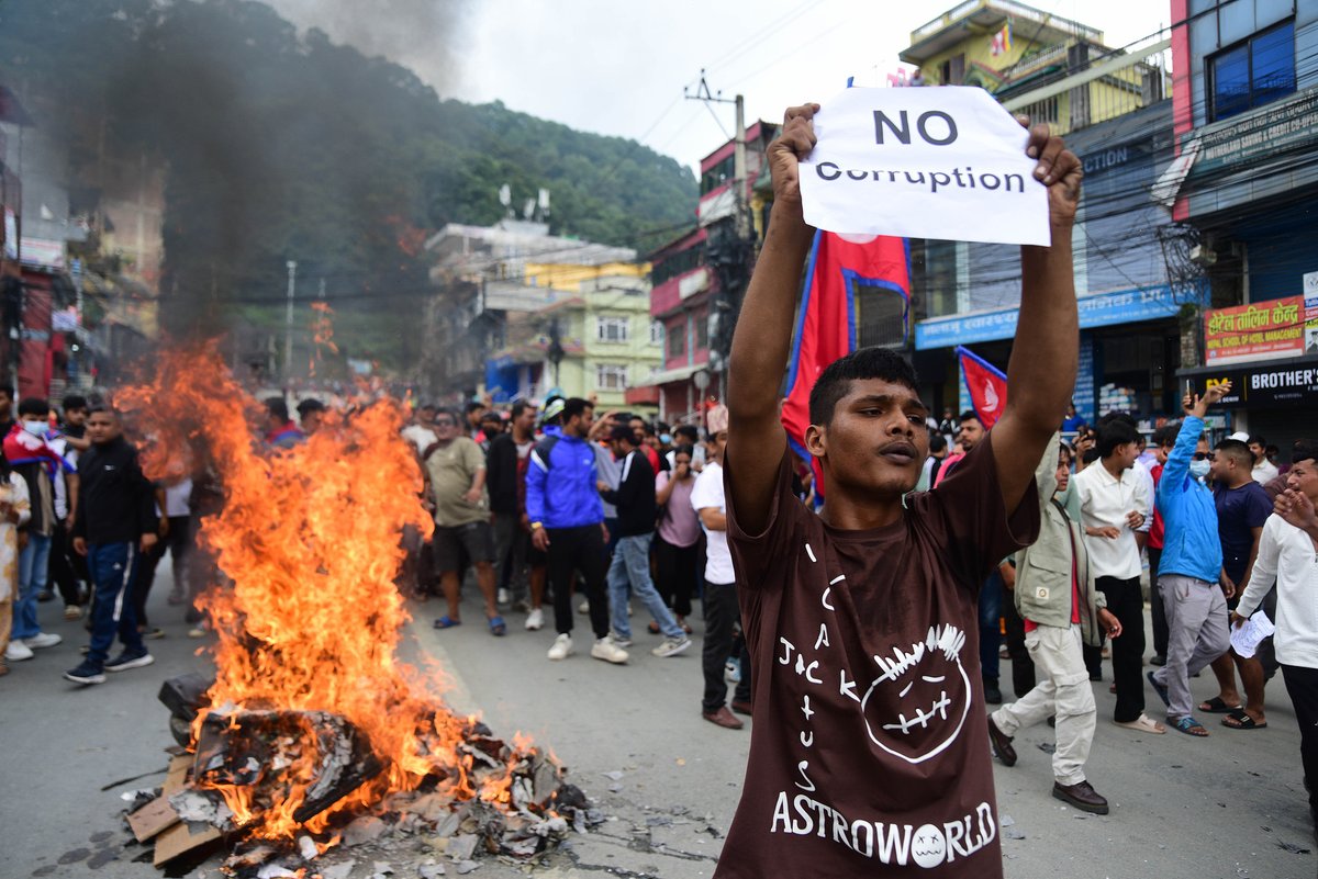 Frontlinestory's tweet photo. #FrontlineFocus: Nepal's Unrest — What's Happening and Why It Turned Violent
Nepal's prime minister has resigned following a wave of violent protests, with at least 22 confirmed dead, and around 200 injured. Here’s all you need to know:

👉What just happened?
-Prime Minister KP Sharma Oli resigned on Sept 9, 2025.
-Protesters set fire to the parliament building in #Kathmandu, filling the sky with thick black smoke, and clashed with police.
-Government buildings and politicians' homes were attacked across the country.

👉How did it all start?
The unrest began after the government banned 26 social media platforms — including #WhatsApp, #Instagram, and #Facebook — saying they hadn't registered with #Nepal's Ministry of Communication and IT.
Critics called it an attempt to silence an anti-corruption movement. Under pressure, the government repealed the ban on Monday night.

👉Who is protesting?
The protesters are mostly young people, identifying themselves as Gen Z. The label has now become a rallying symbol across the movement.

👉What do they want?
Their demands are simple but powerful: Free access to social media (now restored). An end to what they describe as “corrupt practices” in government.

🔍What's next?
With the prime minister’s resignation and protests still spreading, Nepal's political future remains uncertain.
#Nepal #Protest #GenZ