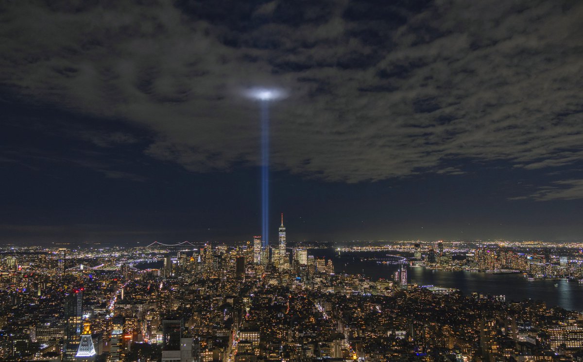 GaryHershorn's tweet photo. The Tribute in Light is illuminated above lower Manhattan and One World Trade Center in New York City seen from the Empire State Building, Tuesday evening #newyorkcity #nyc #tributeinlight @empirestatebldg https://t.co/lDbGgH5Hbs